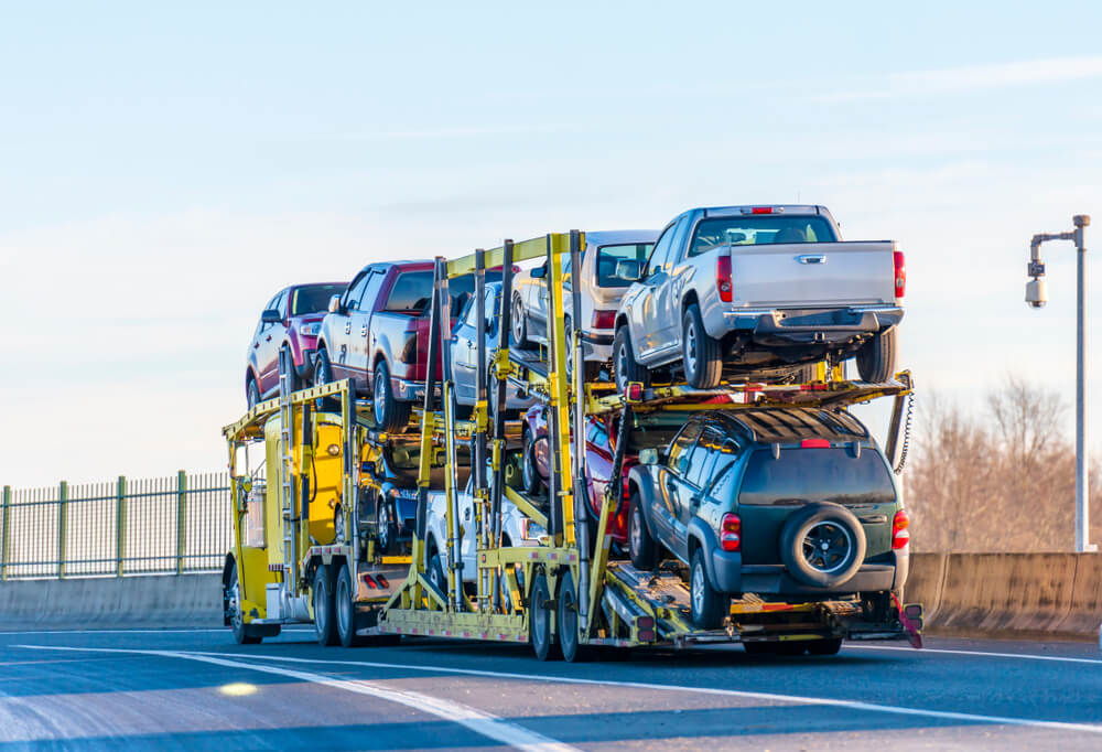 Car Being Secured On Transport Trailer